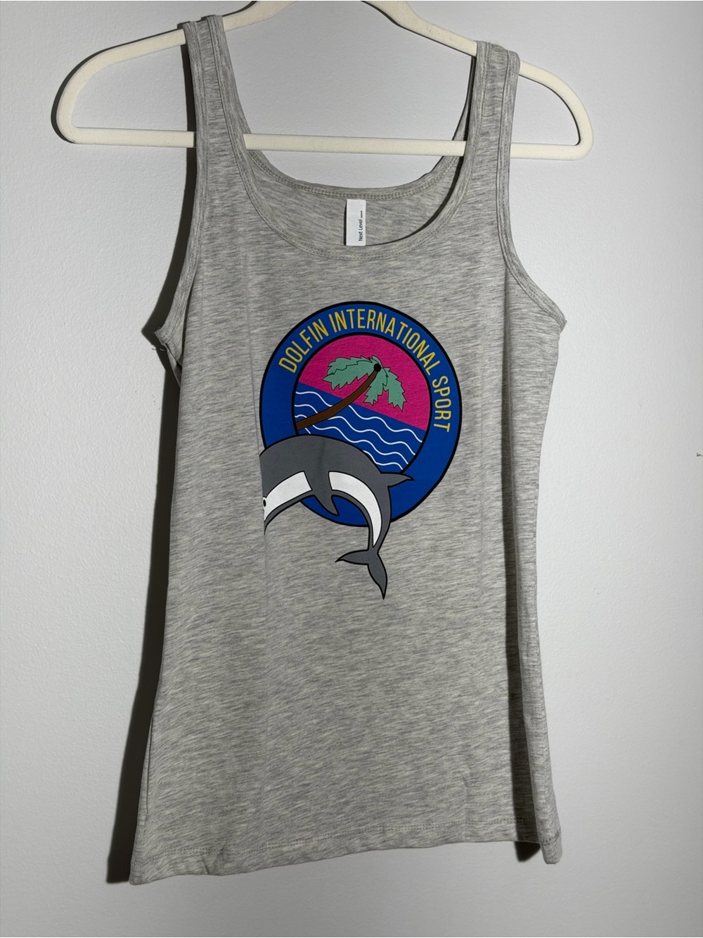 Set of 2 Next Level brand tank top features a "DOLFIN INTERNATIONAL SPORT “